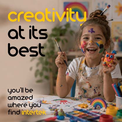 A young smiling while covered in art paint